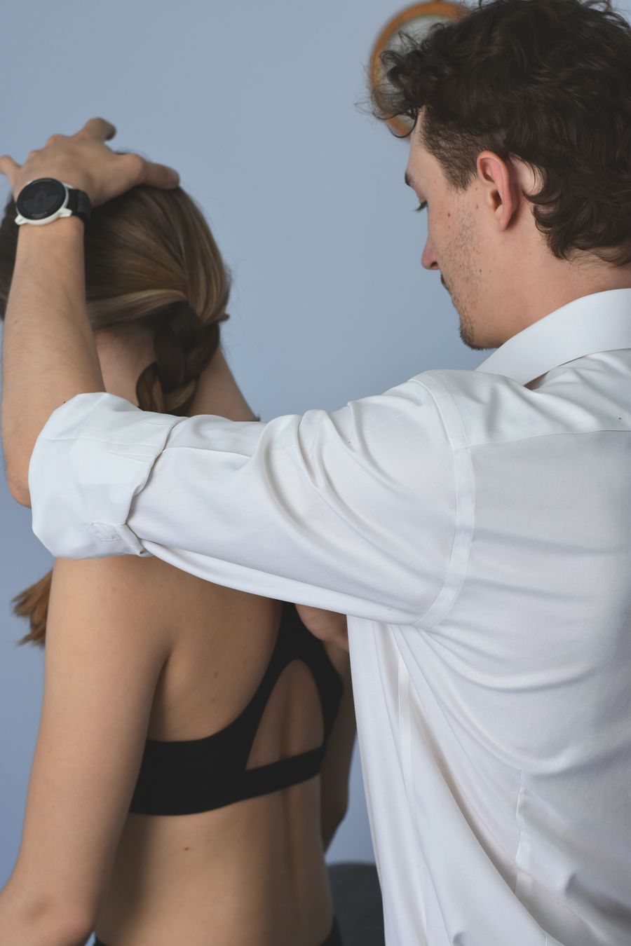 Osteopath assessing neck and shoulder movement at Verteo, Marylebone